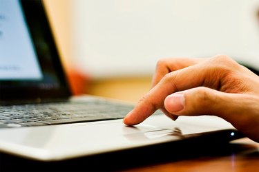 Someone using a laptop computer.
