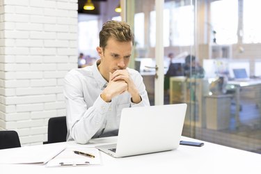 Man working on his laptop at the office in startup